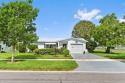 BRAND NEW METAL ROOF! Welcome to this beautiful Challenger model for sale in Boynton Beach Florida Palm Beach County County on GolfHomes.com