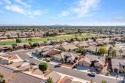 Nestled in a quiet neighborhood, this rare 3-bedroom home offers for sale in Peoria Arizona Maricopa County County on GolfHomes.com