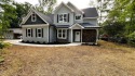 Welcome to this stunning new home nestled on a spacious, wooded for sale in Zebulon North Carolina Wake County County on GolfHomes.com