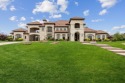 Resting on a 1-acre corner lot in the gated Estates at Craig for sale in Mckinney Texas Collin County County on GolfHomes.com