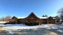 Sophisticated 2-bedroom, 2-bathroom condo in a stunning log for sale in Green Lake Wisconsin Green Lake County County on GolfHomes.com