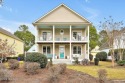 Charleston style architecture with 2 front porches facing the for sale in Sunset Beach North Carolina Brunswick County County on GolfHomes.com