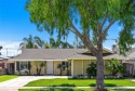 This beautiful beach home resides on a quiet interior tract for sale in Huntington Beach California Orange County County on GolfHomes.com