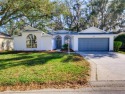 This meticulously-kept custom home offers an oversized custom for sale in Leesburg Florida Lake County County on GolfHomes.com