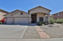 This beautiful upgraded 4/2.5 golf course home features a split for sale in Maricopa Arizona Pinal County County on GolfHomes.com