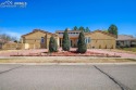 This Mediterranean ranch sits on a large corner lot, walking for sale in Pueblo Colorado Pueblo County County on GolfHomes.com