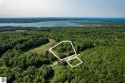 Enjoy the sunsets atop your own piece of the world looking over for sale in Arcadia Michigan Manistee County County on GolfHomes.com