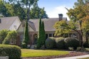 This meticulously maintained Tudor idyllically located in for sale in Atlanta Georgia De Kalb County County on GolfHomes.com