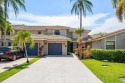 Stunning one-of-a-kind waterfront townhouse in Deer Creek golf for sale in Deerfield Beach Florida Broward County County on GolfHomes.com