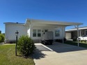 Welcome home to this impeccable 2-bedroom 2-bath sanctuary for sale in Winter Haven Florida Polk County County on GolfHomes.com