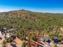 Highland Meadows is Located in the mature pine trees and steps for sale in Williams Arizona Coconino County County on GolfHomes.com
