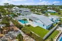 Welcome to your dream home in Tequesta Country Club! This for sale in Tequesta Florida Palm Beach County County on GolfHomes.com