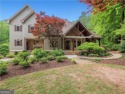 This European-style home offers an array of luxurious features for sale in Flowery Branch Georgia Hall County County on GolfHomes.com