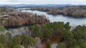 Take in the breathtaking lake and mountain views from this 1.23 for sale in Salem South Carolina Oconee County County on GolfHomes.com