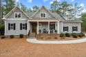 This meticulously crafted 4-bedroom home offers a private feel for sale in Pinehurst North Carolina Moore County County on GolfHomes.com