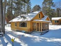 This charming vintage 2 bedroom log sided cottage offers a cozy for sale in St  Germain Wisconsin Vilas County County on GolfHomes.com