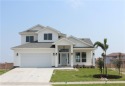 WALKING distance to the BEACH and water views galore! Custom for sale in Corpus Christi Texas Nueces County County on GolfHomes.com