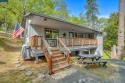 Escape to your own peaceful mountain retreat in the gated for sale in Groveland California Tuolumne County County on GolfHomes.com