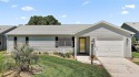 BOND PAID!  Welcome to this Delightful 2 Bedroom, 2 Bath Ranch for sale in Lady Lake Florida Sumter County County on GolfHomes.com
