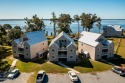 This fully furnished, two-bedroom, two-bath condominium offers a for sale in Minnesott Beach North Carolina Pamlico County County on GolfHomes.com