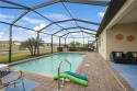 Welcome to your peaceful lakefront oasis at 11992 Arbor Trace Dr for sale in Fort Myers Florida Lee County County on GolfHomes.com