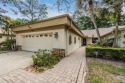 Beautiful home right on the Tarpon Woods Golf Course! Nestled in for sale in Palm Harbor Florida Pinellas County County on GolfHomes.com