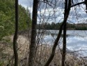 This lot has it all! Acreage, privacy, 149 feet of lake frontage for sale in M ER CE R Wisconsin Iron County County on GolfHomes.com