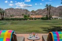 Dazzling wrap-around mountain views highlight this spectacular for sale in La Quinta California Riverside County County on GolfHomes.com