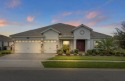 Live a life of effortless luxury in this Grande Charleston for sale in Champions Gate Florida Osceola County County on GolfHomes.com