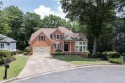 Tucked away at the end of a rare double cul-de-sac, this for sale in Suwanee Georgia Forsyth County County on GolfHomes.com