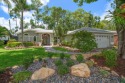 Discover this beautifully landscaped and thoughtfully renovated for sale in Palm Harbor Florida Pinellas County County on GolfHomes.com
