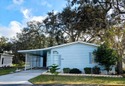 This spacious 3 bdrm, 2 bath PALM HARBOR is completely furnished for sale in Zephyrhills Florida Pasco County County on GolfHomes.com