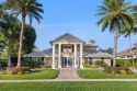 Enjoy lakefront sunsets from this elegant home in the gated for sale in Wellington Florida Palm Beach County County on GolfHomes.com