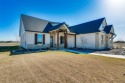 Exquisite new build in gated community with 24 hour security for sale in Cleburne Texas Johnson County County on GolfHomes.com