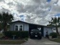 This updated and beautifully decorated singlewide is located on for sale in Mulberry Florida Polk County County on GolfHomes.com