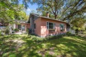 Step into a storybook setting with this charming 2-bedroom for sale in Keystone Heights Florida Bradford County County on GolfHomes.com