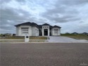 A Must See! Stunning Home located inside the exclusive gated for sale in Edinburg Texas Hidalgo County County on GolfHomes.com