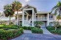 Beautiful long views of golf and tee box from your screened for sale in Naples Florida Collier County County on GolfHomes.com