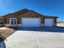 Come on home to this brand new home right on the golf course and for sale in Kingman Arizona Mohave County County on GolfHomes.com
