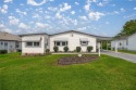 Welcome to this lovely two-bedroom, two-bath home located in the for sale in Lady Lake Florida Lake County County on GolfHomes.com