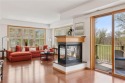 Spacious two-bedroom, two bathroom condo has walls of windows in for sale in Chaska Minnesota Carver County County on GolfHomes.com