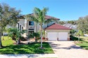 Experience luxurious living in this stunning Mediterranean for sale in Palm Coast Florida Flagler County County on GolfHomes.com