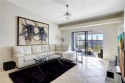 Welcome Home! This ABBEY model END-UNIT condo is located on the for sale in Naples Florida Collier County County on GolfHomes.com