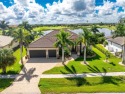 This elegant open concept custom home with superb quality and for sale in Punta Gorda Florida Charlotte County County on GolfHomes.com