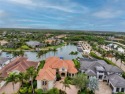 Exceptional open-concept waterfront estate home with boat for sale in Miromar Lakes Florida Lee County County on GolfHomes.com