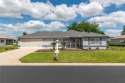 Welcome to this beautifully maintained PALM MODEL with a family for sale in Dunnellon Florida Marion County County on GolfHomes.com