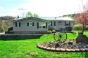 Nestled on just over 2 acres of picturesque land within the for sale in South Franklin Pennsylvania Washington County County on GolfHomes.com