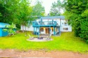 SANDY WATERFRONT Move-in ready Rare one-of-a-kind opportunity on for sale in Summit Lake Wisconsin Langlade County County on GolfHomes.com