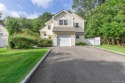 Beautifully updated Woodmist model in the desirable gated for sale in Middle Island New York Suffolk County County on GolfHomes.com