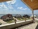 LAKE VIEWS FROM 3 COVERED BALCONIES!  THIS HOME IS READY FOR for sale in Heath Texas Rockwall County County on GolfHomes.com